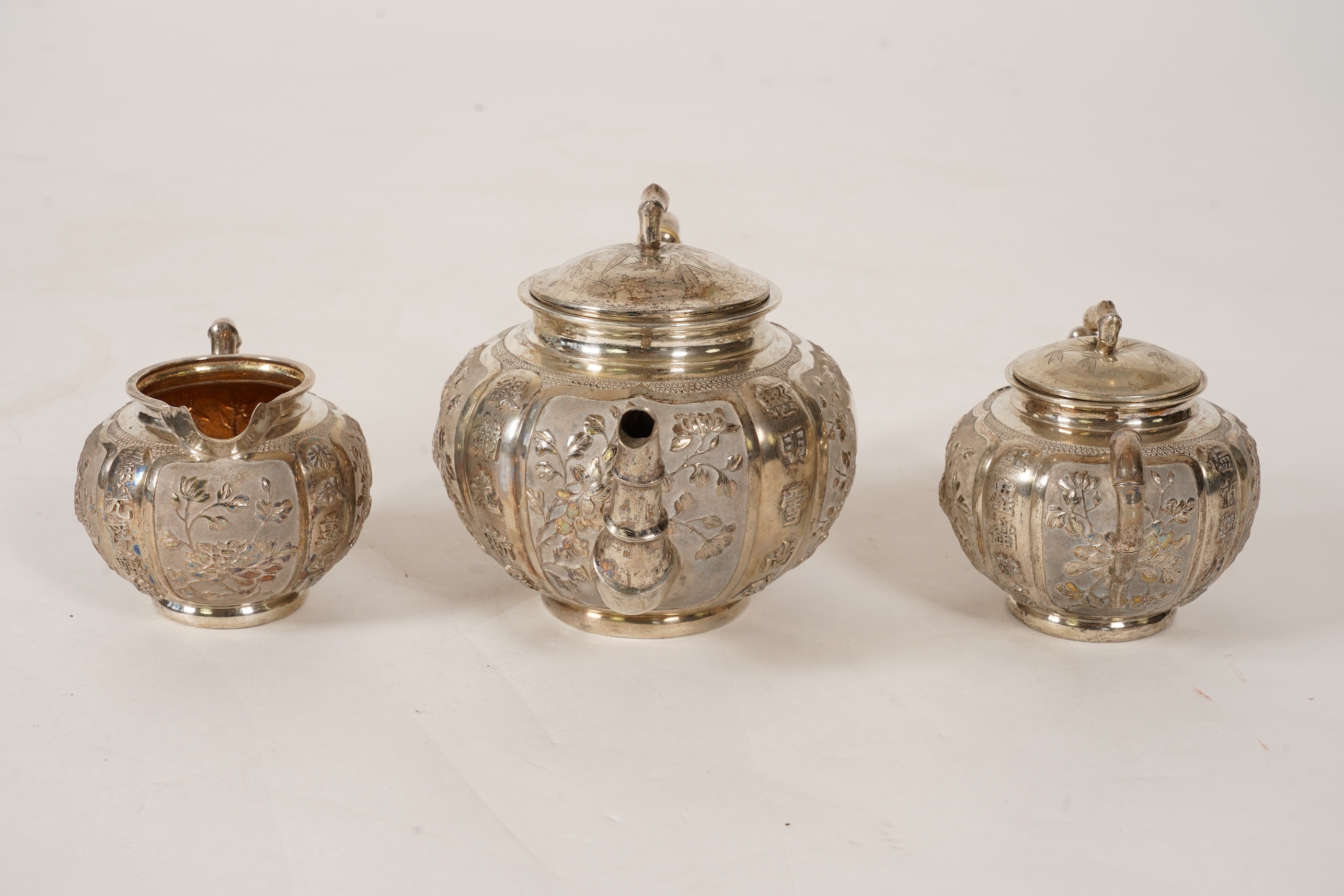 A late 19th/early 20th century Chinese Export white metal three-piece tea set, maker's mark WA